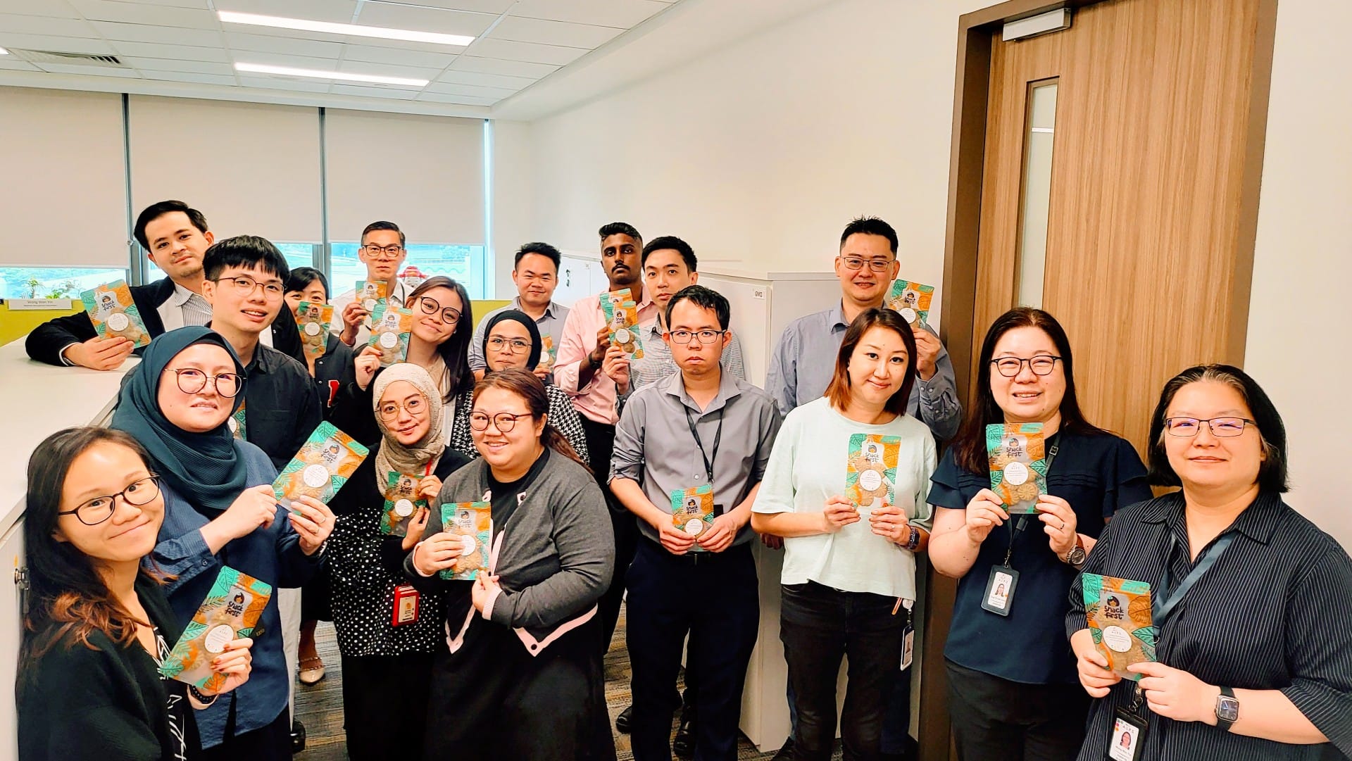 Image of ALPS staff with their Hari Raya festive goodies 